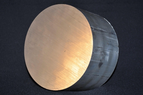 sawing the block of aluminum